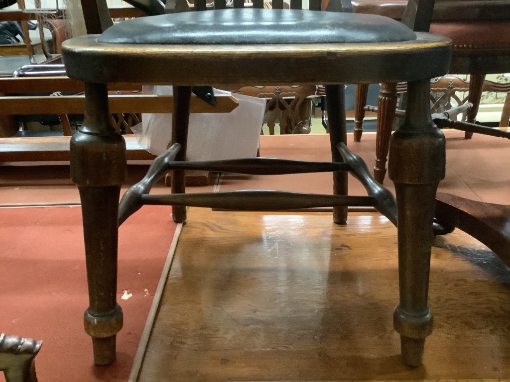 An early 20th century oak desk chair, width 66cm